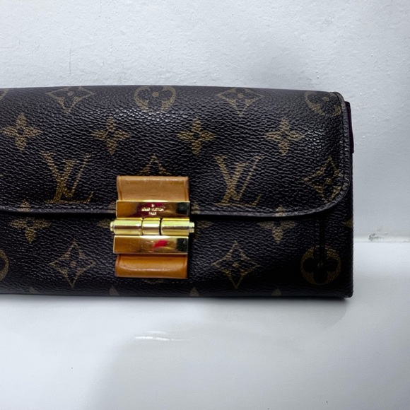 Louis Vuitton Monogram Clutch with Gold Accent - Picture 1 of 14